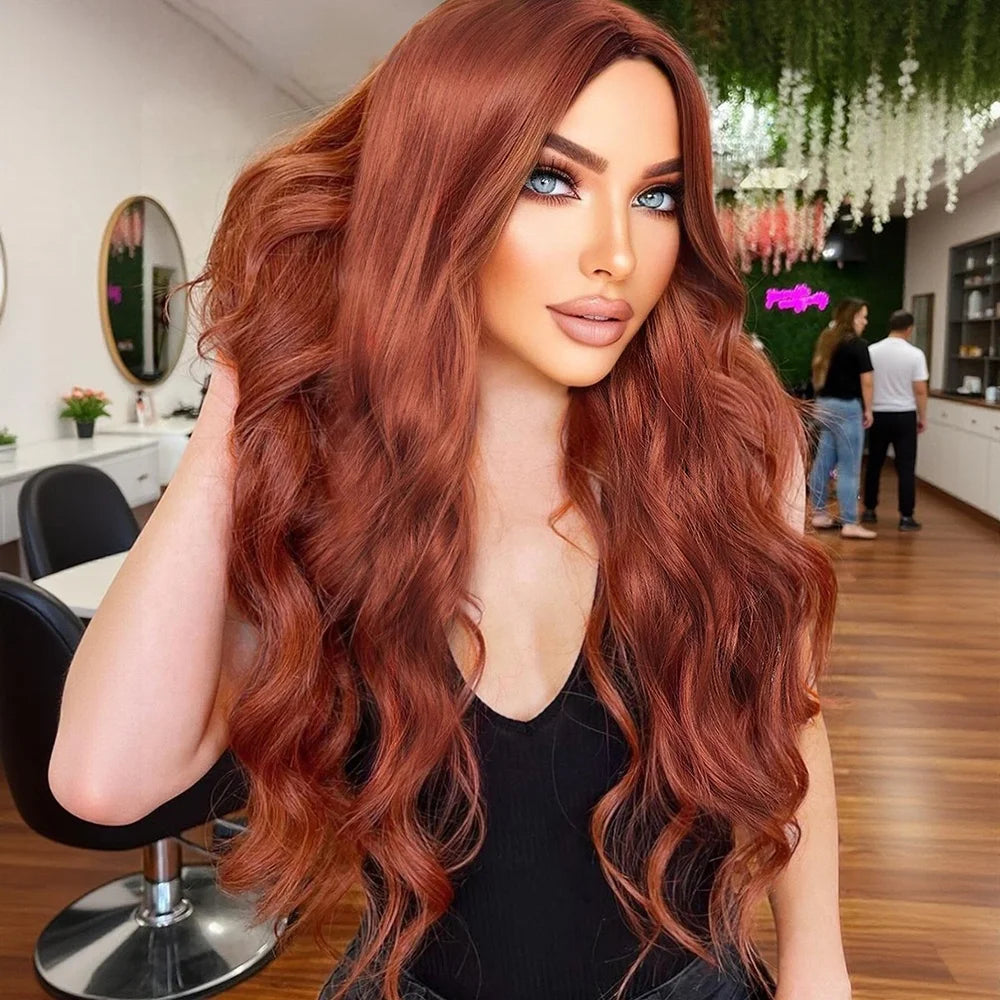 A woman with Trc long, wavy, coppery auburn hair is shown indoors, likely in a salon or styled interior, wearing a black top. The product appears to be the wig or hair color presentation rather than the room itself.