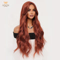 A long, wavy wig in a warm coppery auburn shade displayed on a mannequin head against a plain light background. The brand name TRC is visible in the top left corner.